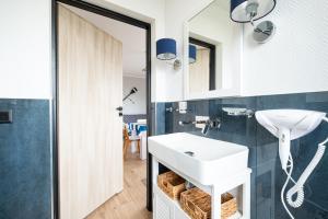 Koupelna v ubytování Bursztynowa Przystań 18 + 32 fotografií