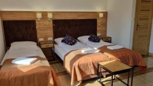 Voodi või voodid majutusasutuse Lubiana Resort toas