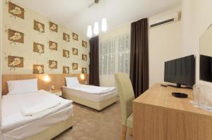 Postel nebo postele na pokoji v ubytování Sky Hotel