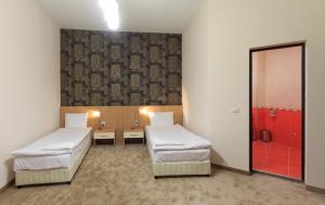 Postel nebo postele na pokoji v ubytování Sky Hotel