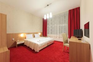 Postel nebo postele na pokoji v ubytování Sky Hotel