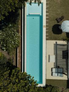 an overhead view of a swimming pool in a yard at Baleias home in Praia do Forte
