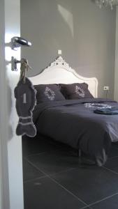 Katil atau katil-katil dalam bilik di B&B Het Postenhofje