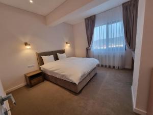 Кровать или кровати в номере Apartament in complex rezidențial