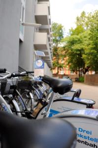 a row of bikes parked next to a building at Hostel SLEPS in Augsburg