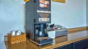 a coffee machine sitting on top of a kitchen counter at Motel 6-Grand Rivers, KY in Grand Rivers