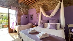 A bed or beds in a room at Agriturismo Le Biricoccole