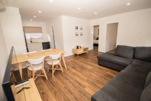 a living room with a table and a couch at Willow Court Unit 3 in Broken Hill