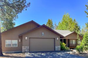 a large house with a garage at Bachelor Sunshine Retreat in Sunriver