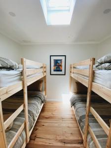 A bunk bed or bunk beds in a room at Wonboyn Cabins