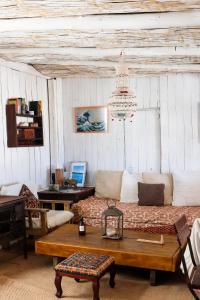 a living room with a couch and a table at Salty House Cabo Polonio in Cabo Polonio