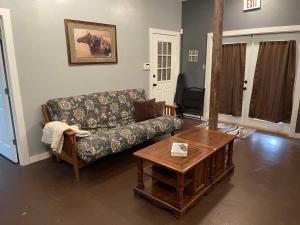 a living room with a couch and a coffee table at Trails End Retreat in Bandera