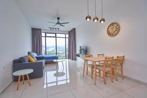 a living room with a table and a dining room at 2BR Georgetown Luxury Suite #RoofTopPool #Beacon in George Town