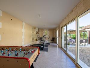 a living room with a pool table and a pool table at Maison de charme avec piscine privée, salle de sport proche de Bergerac et Périgueux - FR-1-616-132 in Villamblard