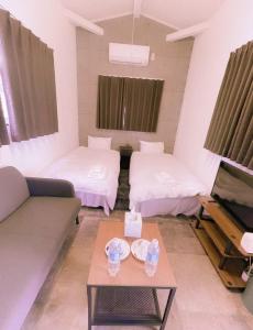 Letto o letti in una camera di Necoana Glamping富士山景BBQトレーラーヴィラ
