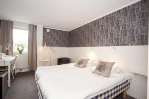 Postel nebo postele na pokoji v ubytování Lages Motel + 29 fotografií