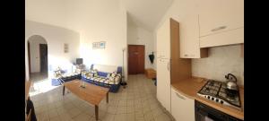 a kitchen with white cabinets and a counter top at Stunning views, 2-Bed Apartment in Scalea in Scalea
