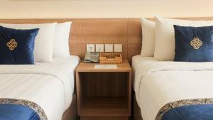 Vuode tai vuoteita majoituspaikassa Antero Hotel Jababeka