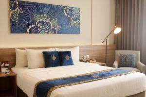 Vuode tai vuoteita majoituspaikassa Antero Hotel Jababeka