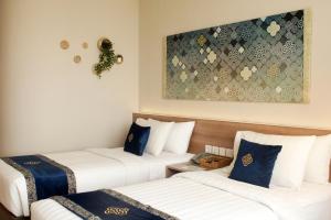 Vuode tai vuoteita majoituspaikassa Antero Hotel Jababeka