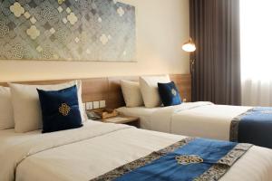 Vuode tai vuoteita majoituspaikassa Antero Hotel Jababeka