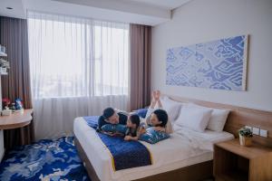 Vuode tai vuoteita majoituspaikassa Antero Hotel Jababeka