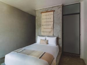Postel nebo postele na pokoji v ubytování Drift San Jose del Cabo, a Member of Design Hotels