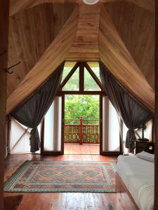 Postel nebo postele na pokoji v ubytování Padi Ecolodge