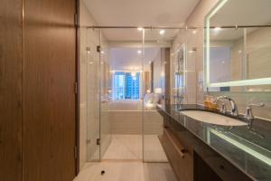 a bathroom with a sink and a shower at Nha Trang Superview Holidays in Nha Trang +137 photos