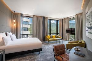 A television and/or entertainment centre at Pullman Tbilisi Axis Towers