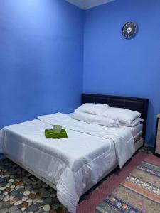 מיטה או מיטות בחדר ב-Kak Pah Homestay