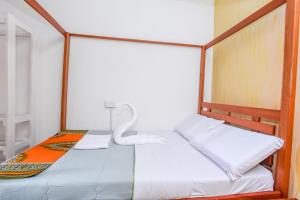 Postel nebo postele na pokoji v ubytování Enkayz Mombasa