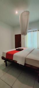 Postel nebo postele na pokoji v ubytování Sammy Homestay