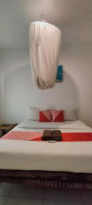 Postel nebo postele na pokoji v ubytování Sammy Homestay