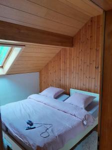a bedroom with two beds and a window in it at Soubey (Clairbief) in Soubey