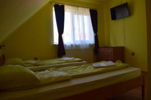 Letto o letti in una camera di Gamma