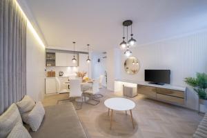 a living room with a table and a dining room at Luxury Villa Christian in Umag