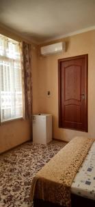 Hotel SUGD & Guest House客房内的一张或多张床位