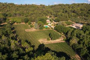 an aerial view of a farm house on a hill at Bastide de Fave in Brue-Auriac