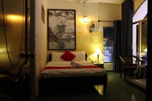 Giường trong phòng chung tại Bukchon Da Lat Hotel
