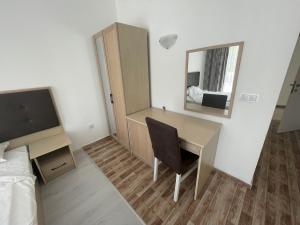 a room with a desk and a mirror and a bed at Cozy Elegant Room in Perla Del Mar complex in Lozenets