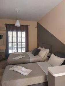 Postel nebo postele na pokoji v ubytování AK VILLAGE ROOMS + 28 fotografií