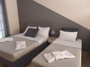 Postel nebo postele na pokoji v ubytování AK VILLAGE ROOMS