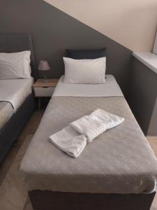Postel nebo postele na pokoji v ubytování AK VILLAGE ROOMS