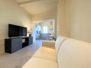 Televiisor ja/või meelelahutuskeskus majutusasutuses TRA LE MURA-central apartment in Siena