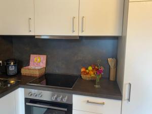 a kitchen with a counter with a bowl of fruit at Ferienwohnung Alpennestchen Tschagguns in Tschagguns