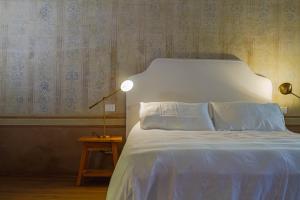 Postel nebo postele na pokoji v ubytování Palazzo Glori 6