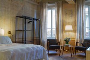 Postel nebo postele na pokoji v ubytování Palazzo Glori 6