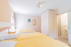 Postel nebo postele na pokoji v ubytování Hotel Le Postillon