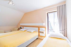 Postel nebo postele na pokoji v ubytování Hotel Le Postillon